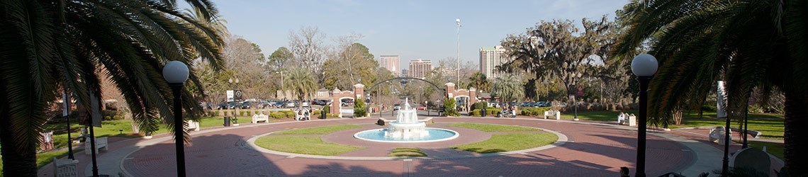 Wide-shot photo of Wescott Fountain and the circular brick pathway around it 